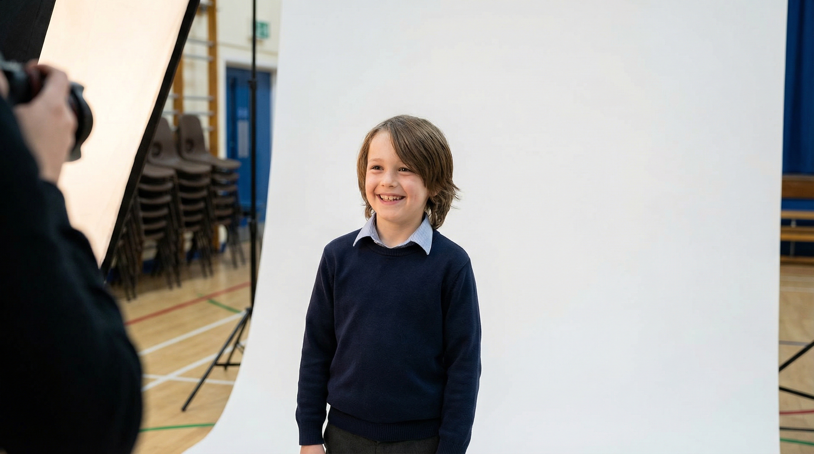 Student being photographed with professional studio lighting